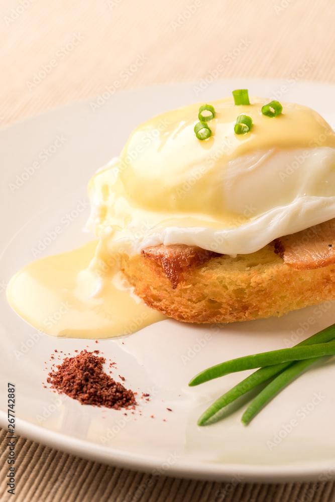 Breakfast is Eggs Benedict - toasted English muffins, bacon, ham, poached eggs, herbs and delicious buttery hollandaise sauce. Breakfast is Eggs Benedict - toasted English muffins, bacon, ham, poached eggs, herbs and delicious buttery hollandaise sauce.