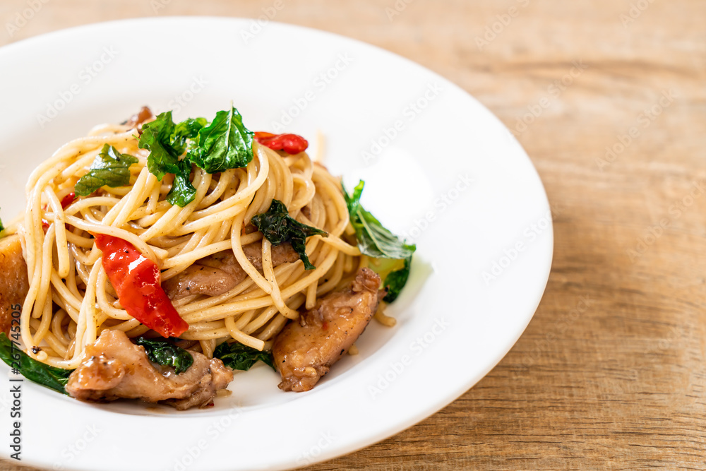stir-fried spaghetti with chicken and basil