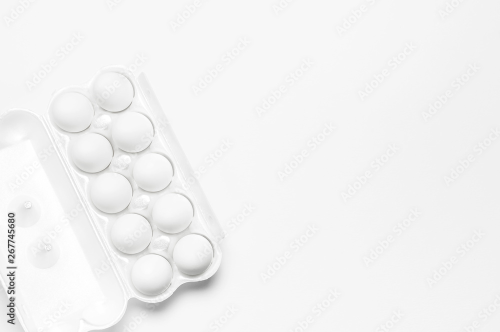 White chicken eggs in white packaging on light background top view flat lay copy space. Eggs in box, natural healthy food and organic farming concept. Creative food minimalistic background, Easter White chicken eggs in white packaging on light background top view flat lay copy space. Eggs in box, natural healthy food and organic farming concept. Creative food minimalistic background, Easter
