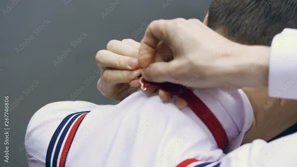 close-up, view from behind, a man dresses a butterfly. close-up, view from behind, a man dresses a butterfly.