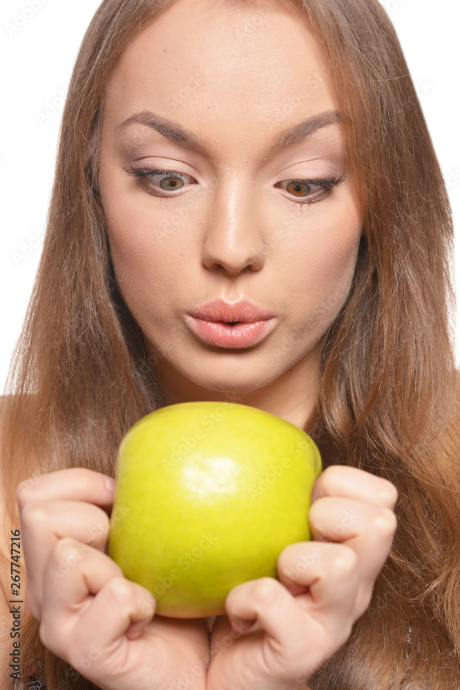 Portrait of beautiful young woman with green apple Portrait of beautiful young woman with green apple