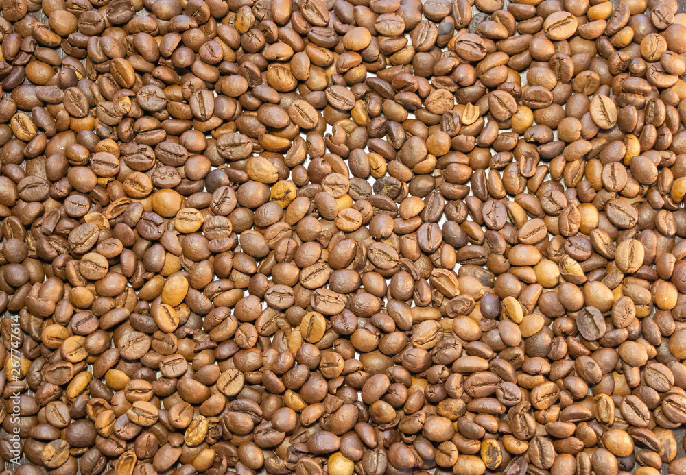 Cup of coffee beans, Scattered coffee beans around the cup Cup of coffee beans, Scattered coffee beans around the cup