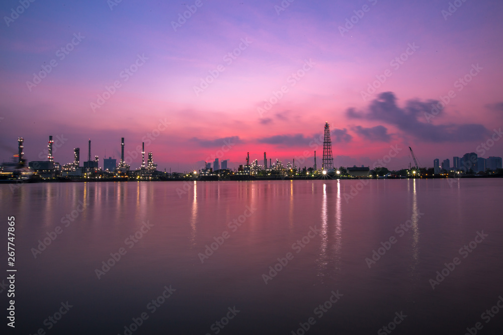 The blurred background of nature along the river, with views of the cargo ship, oil refinery, sunrise and beautiful sky in the morning The blurred background of nature along the river, with views of the cargo ship, oil refinery, sunrise and beautiful sky in the morning