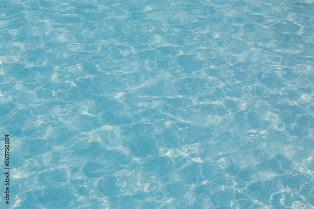 Blue pool water with sun reflection Blue pool water with sun reflection