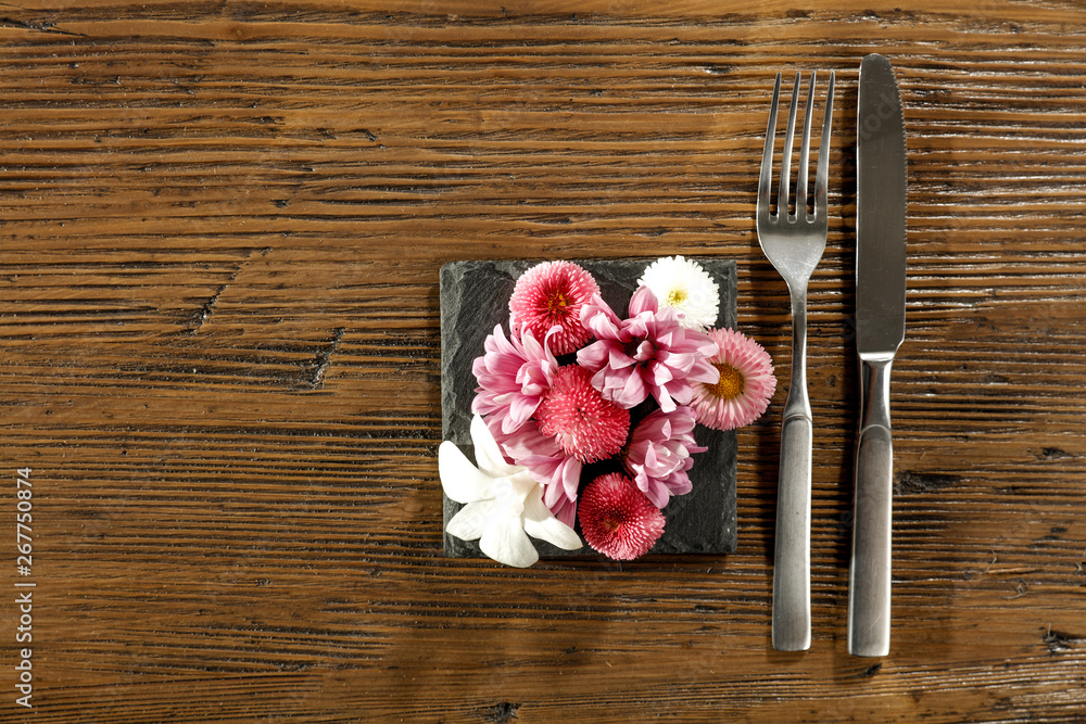 Fresh flowers and kitchen desk with fork Fresh flowers and kitchen desk with fork