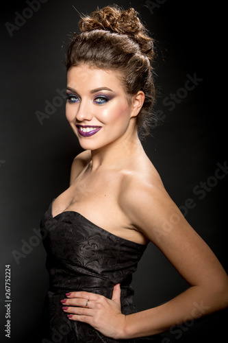 High fashon portrait of a beautiful woman, makeup, smile, sexy party look
