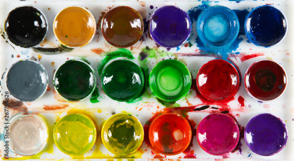 A set of children's paints in circular forms close-up