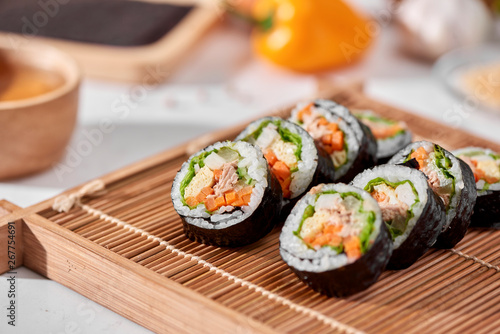 Korean roll Gimbap(kimbob) made from steamed white rice (bap) and various other ingredients photo