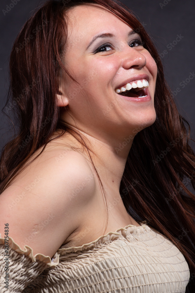 Pretty hispanic girl with long hair smiling Pretty hispanic girl with long hair smiling