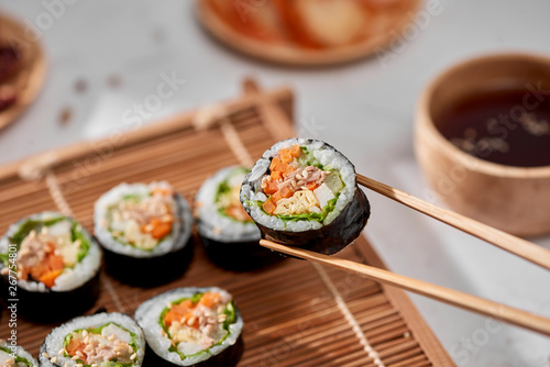Korean roll Gimbap(kimbob) made from steamed white rice (bap) and various other ingredients photo