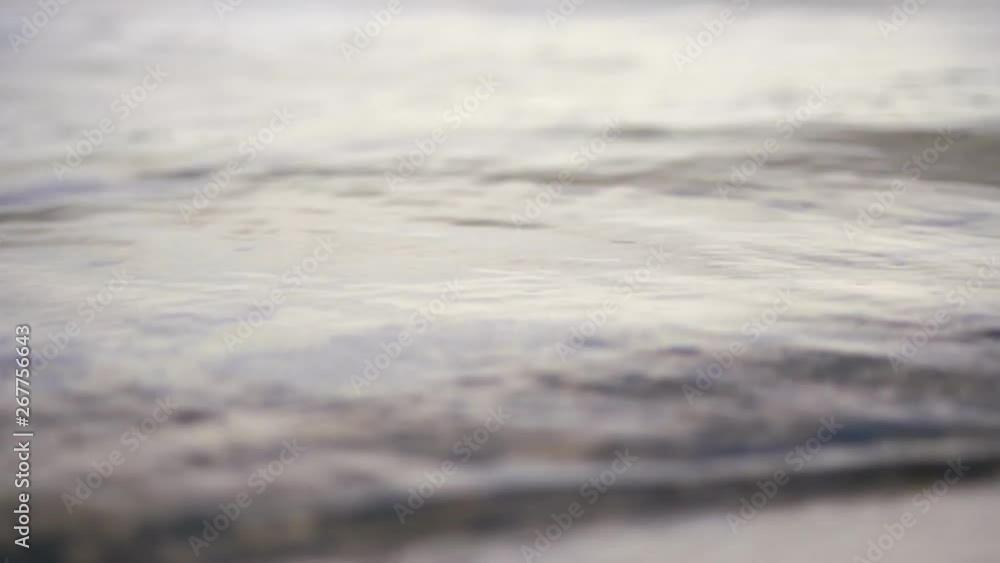 close-up, river surf, small waves on the beach, clear river water. close-up, river surf, small waves on the beach, clear river water.