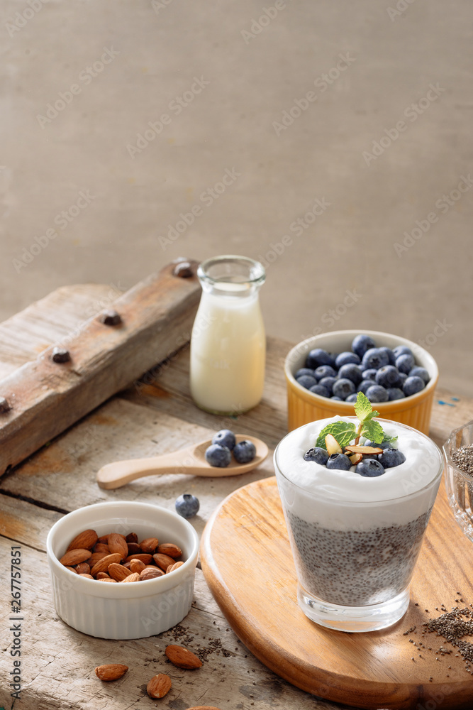 Chia pudding with berries and milk, sweet nourishing dessert, healthy breakfast superfood concept Chia pudding with berries and milk, sweet nourishing dessert, healthy breakfast superfood concept