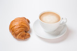 Breakfast coffee with croissants on a white background. Latte on a saucer