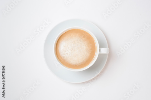Breakfast coffee on a white background. Latte on a saucer
