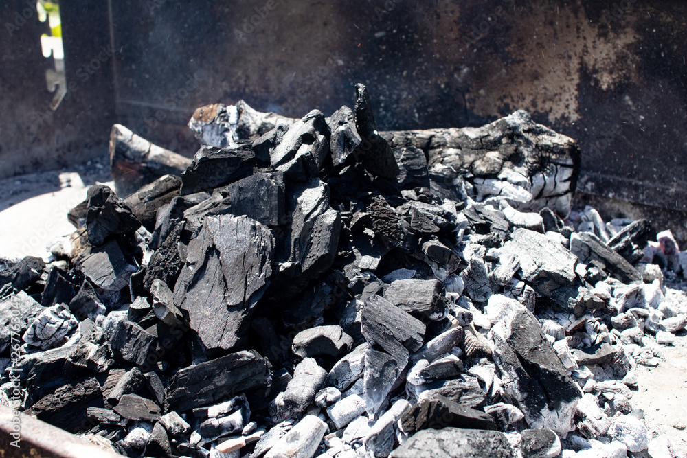 charcoal burning and ready for the barbecue, preparation of the embers to cook meat on the grill. hot steaming charcoal charcoal burning and ready for the barbecue, preparation of the embers to cook meat on the grill. hot steaming charcoal