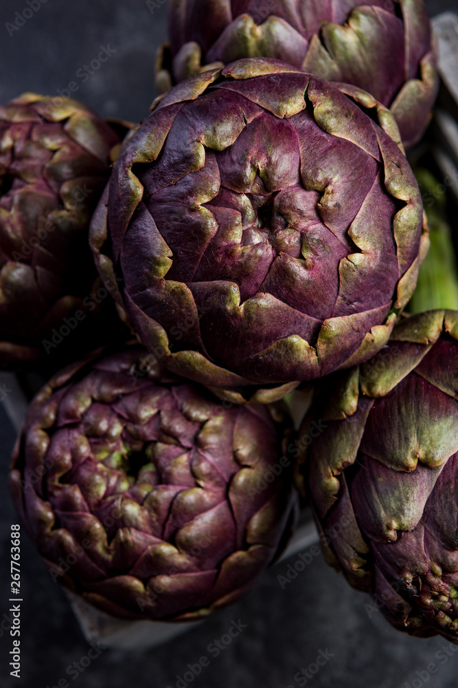 Market fresh purple artichokes in wooden crate Market fresh purple artichokes in wooden crate
