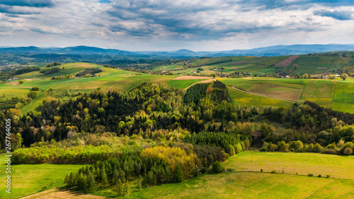 Fototapeta Naklejka Na Ścianę i Meble -  Green hills with meadows and forest, aerial view of polish countryside