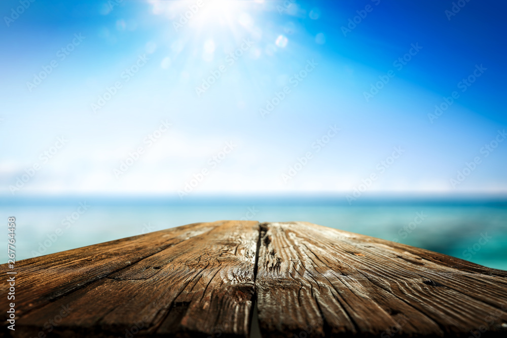 Desk of free space and summer background of sea Desk of free space and summer background of sea
