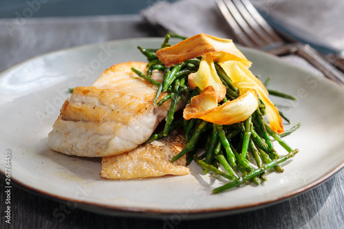 Sea bass fillet with parsnip crisp and samphire  photo