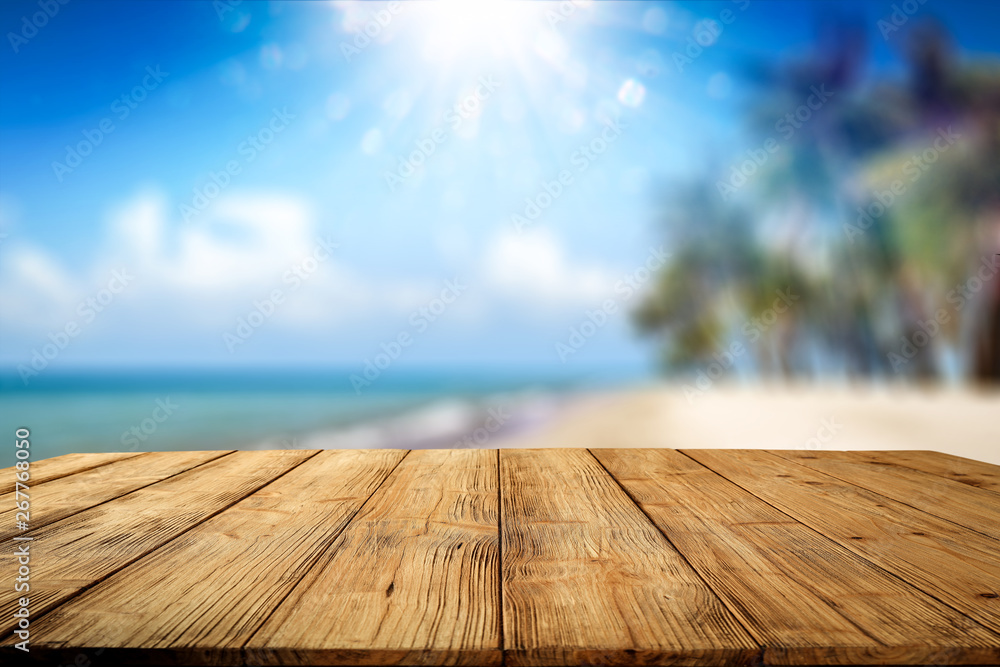 Desk of free space and summer background of beach with palms and summer sea  - obrazy, fototapety, plakaty 