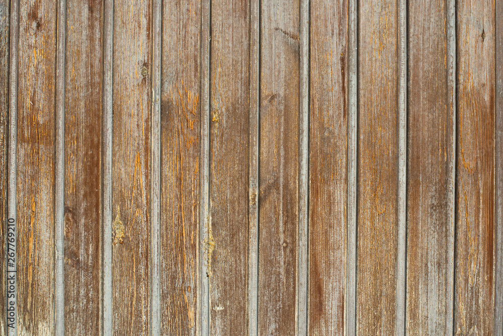  Brown wooden background. Rough texture. Peeling paint