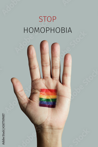 rainbow flag and text stop homophobia photo