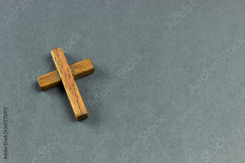 wooden cross on a dark surface