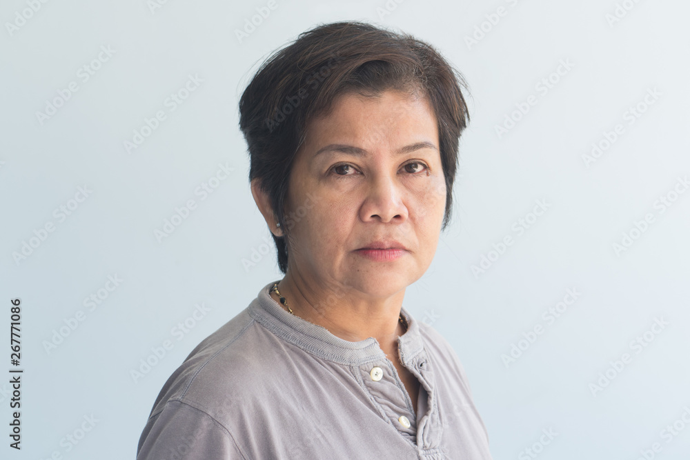 portrait of middle aged old woman with wrinkle skin and slight grey hair portrait of middle aged old woman with wrinkle skin and slight grey hair