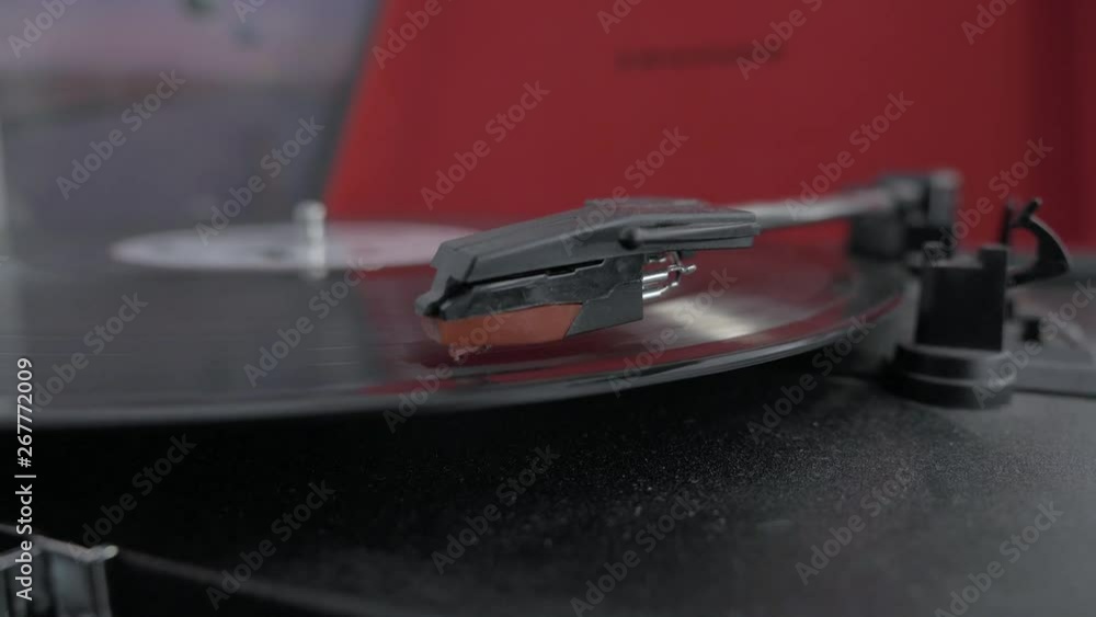 Black music vinyl record spinning.Playing a vinyl record on the gramophone. Close-up.Vinyl Turntable Record Player. Black music vinyl record spinning.Playing a vinyl record on the gramophone. Close-up.Vinyl Turntable Record Player.