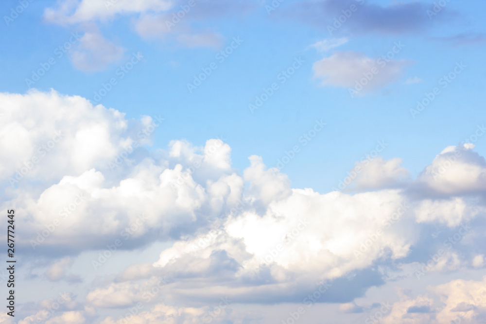 Obraz premium Beautiful gloomy blue sky with fluffy clouds in summer morning peace day as a background. Gray, white and turquoise color blured skyline photography.