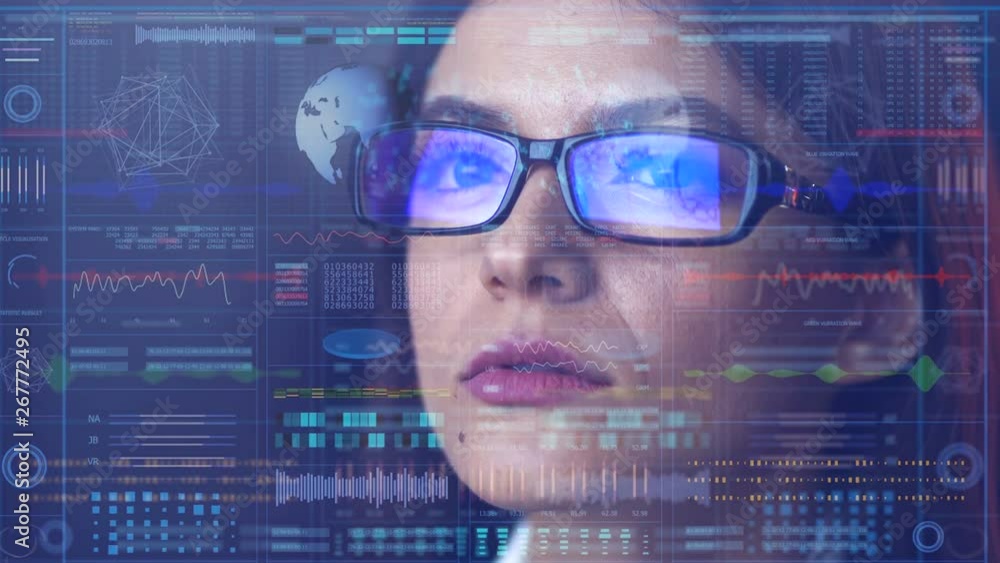 The woman in glasses looking on the display on the hologram background The woman in glasses looking on the display on the hologram background