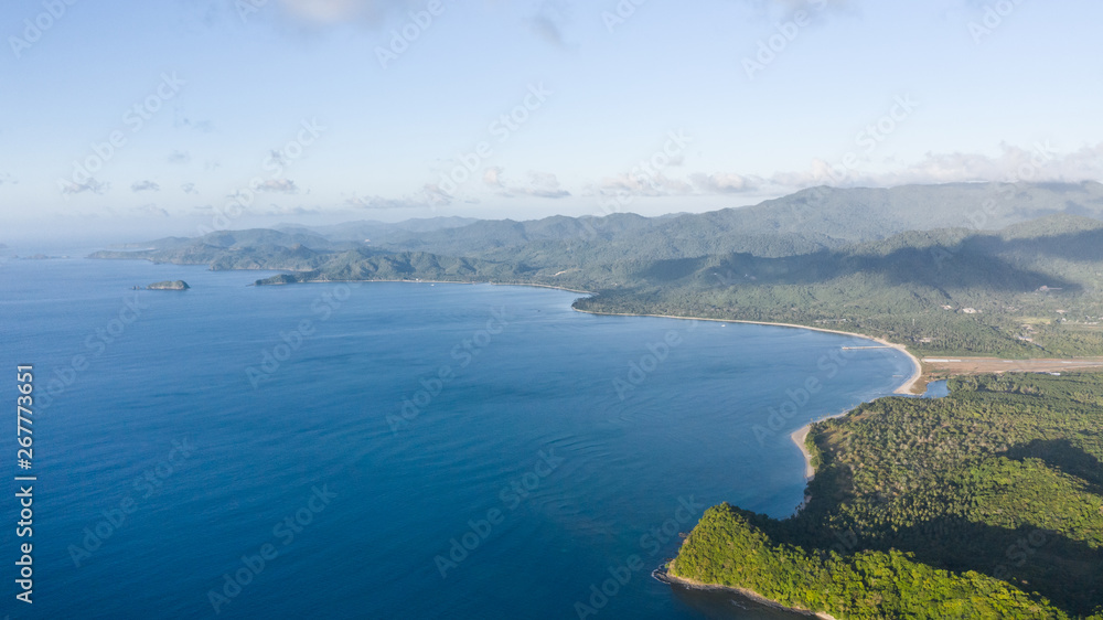 Seascape with islands. Blue sea and large islands. Big island with woodland. Philippines, El Nido