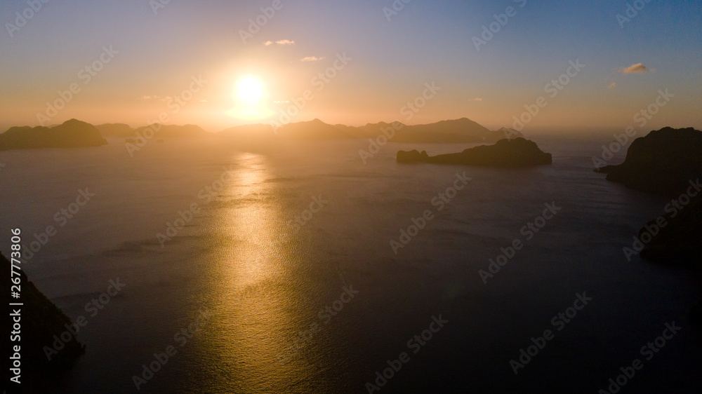 Sunset over the sea with the islands. Seascape with sunset aerial view