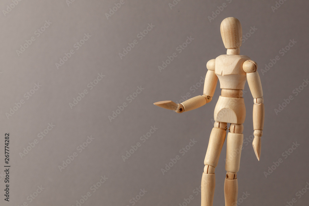 Man stretches his hand forward offering help or asks for donations on a gray background Man stretches his hand forward offering help or asks for donations on a gray background