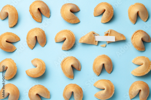 Chinese fortune cookies. Cookies texture pattern with empty blank inside for word prediction. Blue background. photo