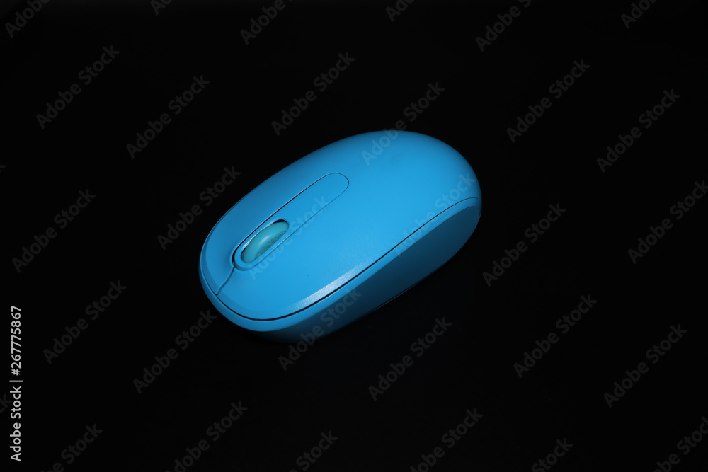 Wireless computer mouse isolated on black background Wireless computer mouse isolated on black background