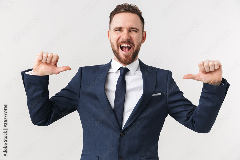 Businessman posing isolated over white wall background pointing to himself. Businessman posing isolated over white wall background pointing to himself.