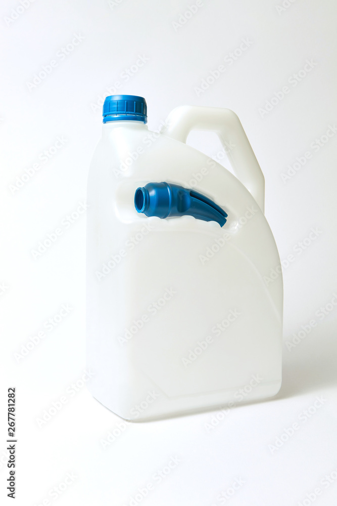 Plastic white canisters mock-up for liquid on a light background. Plastic white canisters mock-up for liquid on a light background.