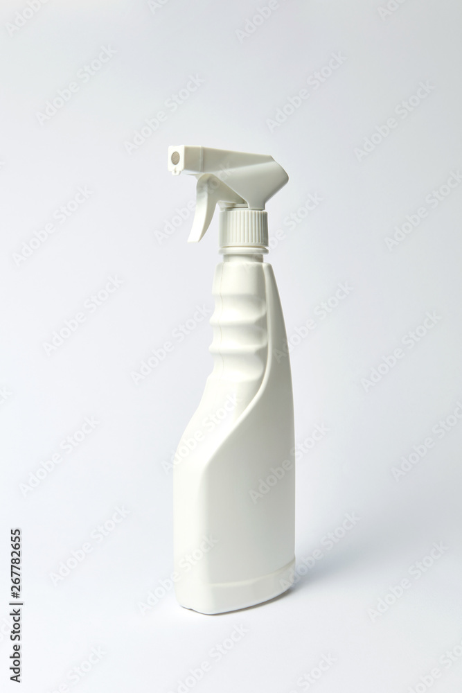 Spray plastic detergent bottle on a light background, mock up. Spray plastic detergent bottle on a light background, mock up.