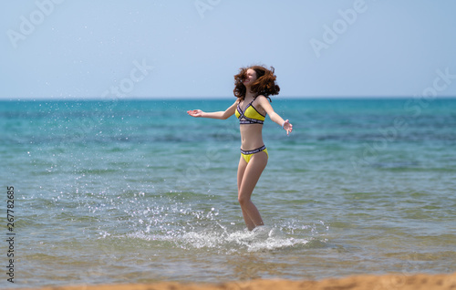 Happy joyful young woman on summer vacation
