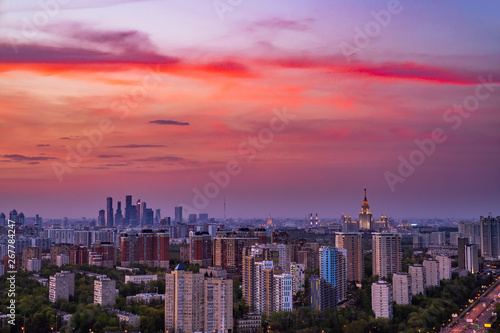 Skyscraper rooftop view on Moscow state University, Moscow City and Vernadskiy avenue at pinky sunset