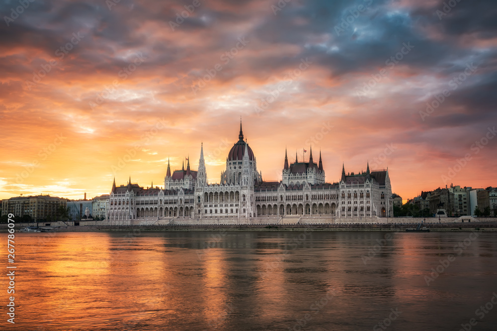 Budapest Parliament at sunrise / Amazing fiery sunrise above Hungarian Parliament in Budapest