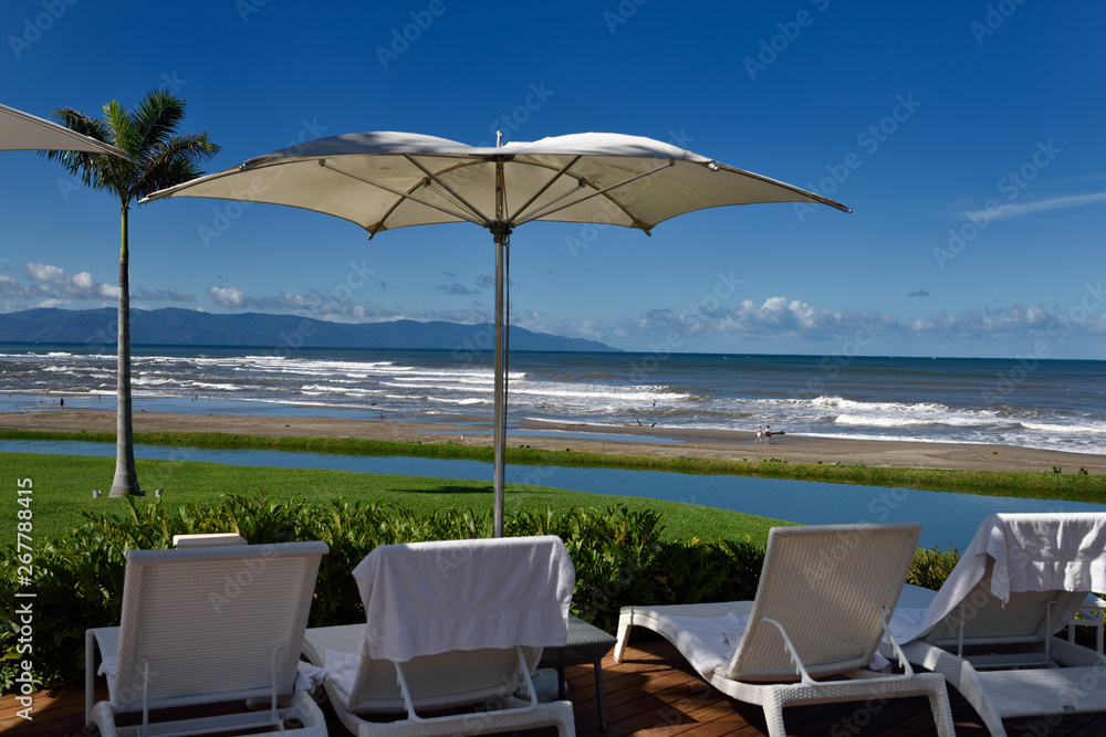 Deck chairs with umbrellas at a resort on the beach of Nuevo Vallarta Mexico