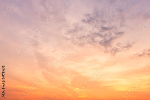 Fototapeta Naklejka Na Ścianę i Meble -  Orange sky background texture with white clouds sunset.