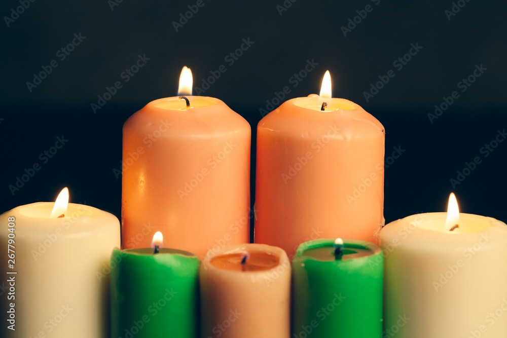 candles burning in darkness over black background. commemoration concept. candles burning in darkness over black background. commemoration concept.