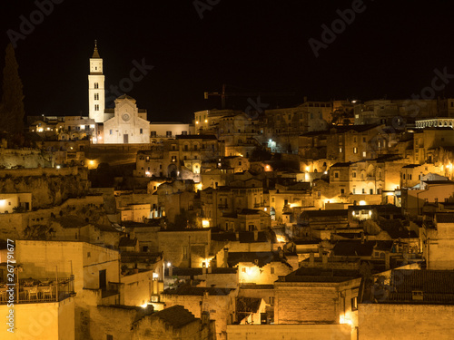 Italy - April, 2019: Amazing lighted buildings in ancient Sassi center by night in Sassi di Matera