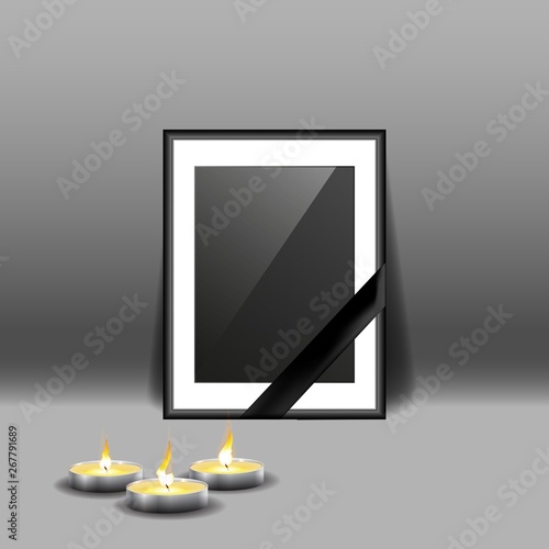 Black mourning frame with black ribbon and burning candles isolated on gray background.