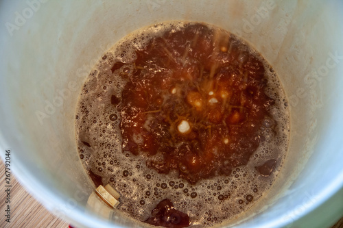 Pouring homemade beer in a barrel, home brew