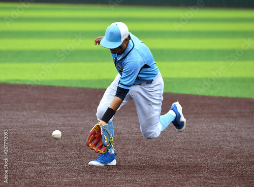 Young athletic boys playing sport of baseball