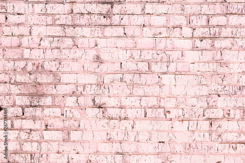 Unusual bright saturated abstract pink background from old brick wall in retro style